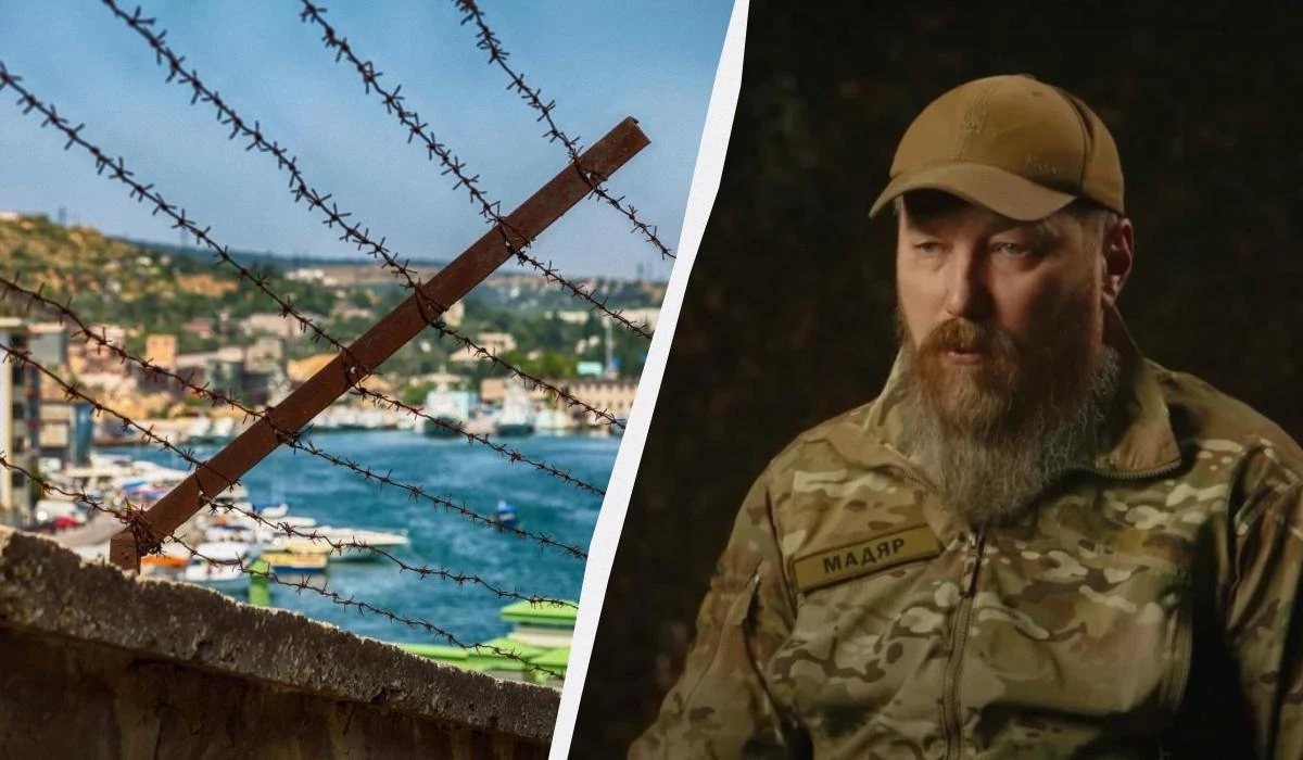 Роберт «Мадяр» Бровді під час інтерв'ю на тлі карти Криму